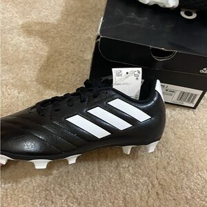 Brand new adidas soccer/football cleets. Size 4